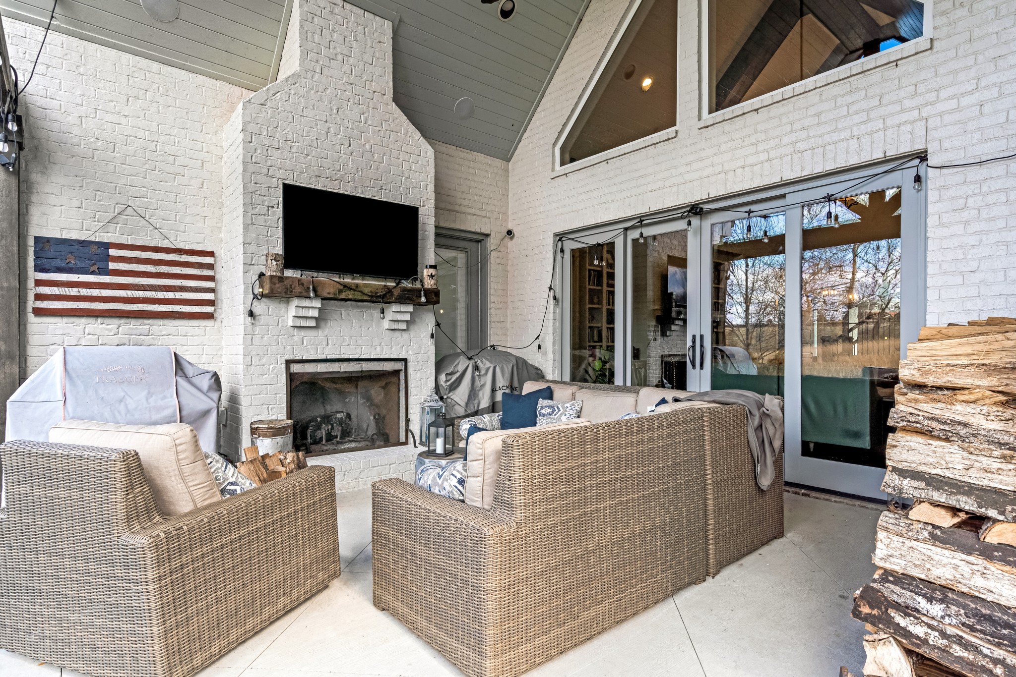 325 Circuit Road Franklin, TN 37064 - Photo 48 of 55 a living room with furniture a flat screen tv and a fireplace