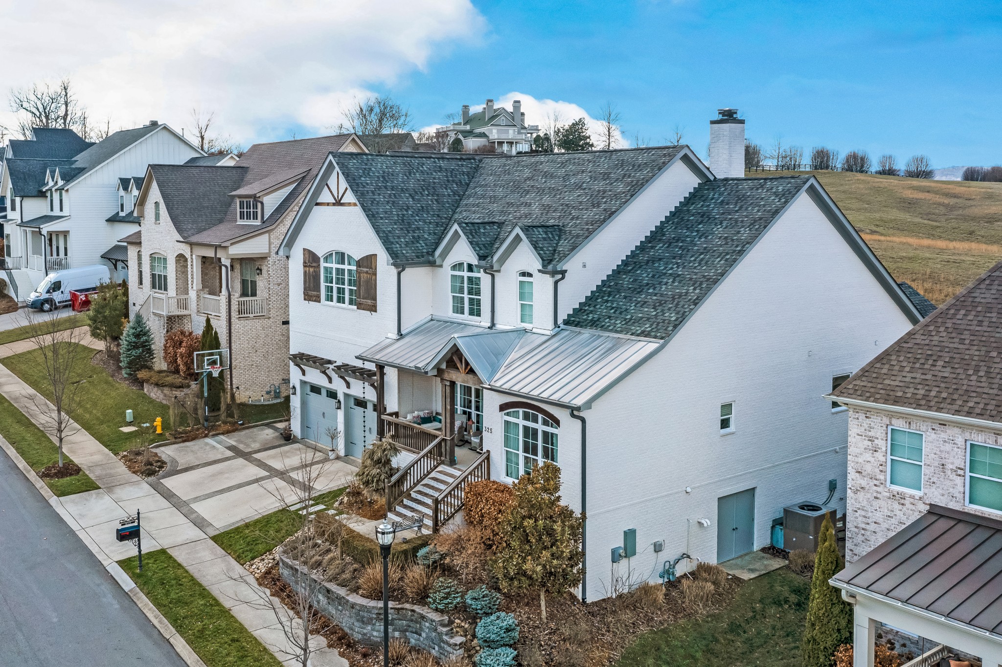 325 Circuit Road Franklin, TN 37064 - Photo 8 of 55 a aerial view of a house with a big yard and potted plants