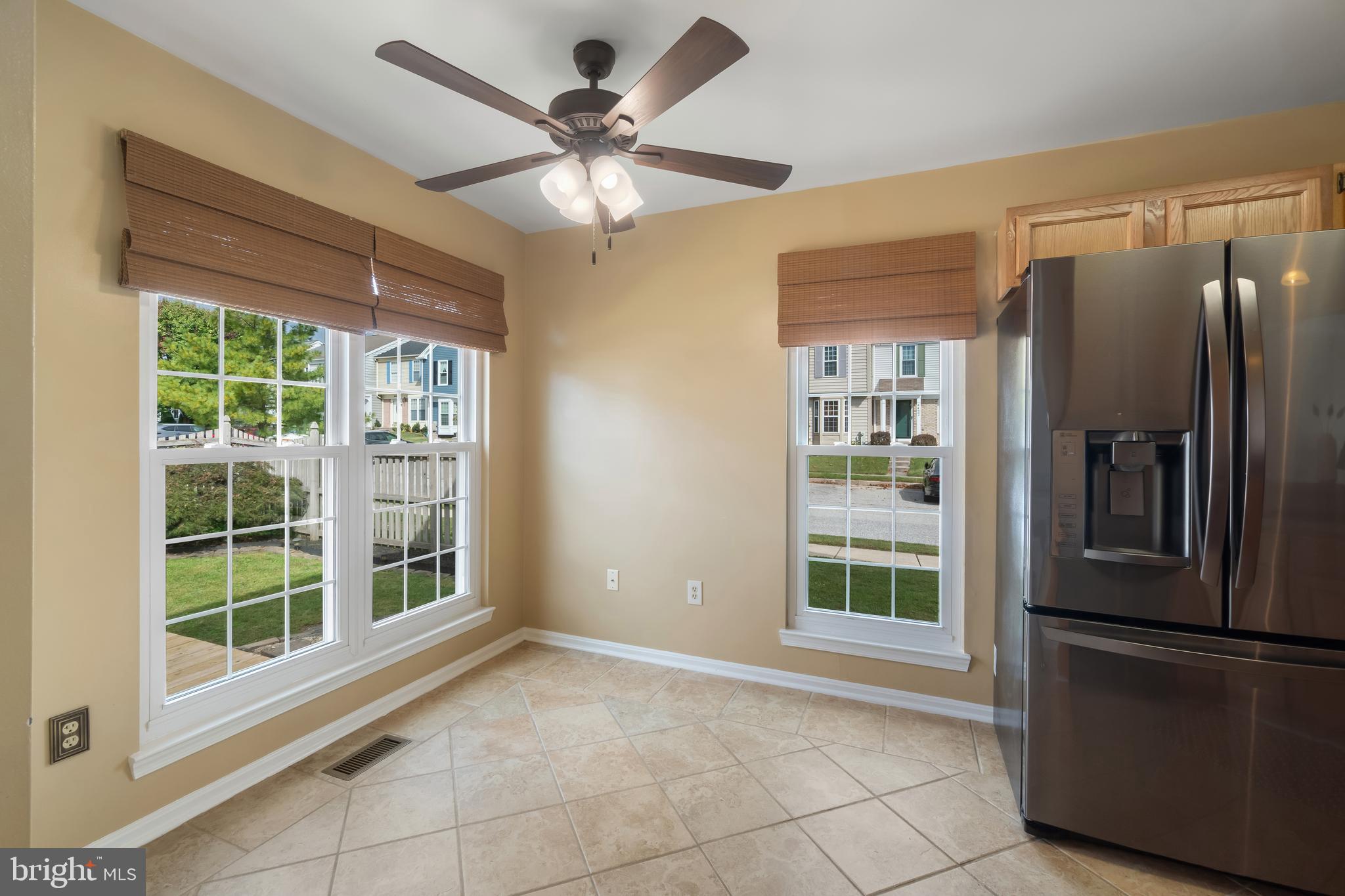 4402 Cole Farm Road Nottingham, MD 21236 - Photo 15 of 42 a view of a refrigerator in kitchen and windows