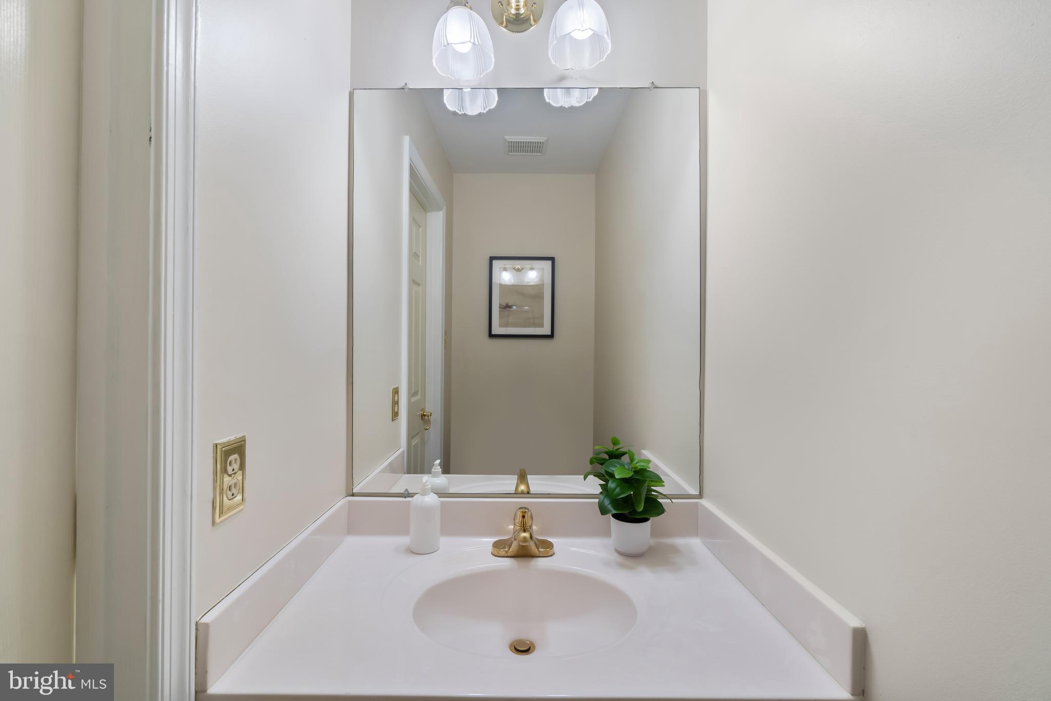 4402 Cole Farm Road Nottingham, MD 21236 - Photo 17 of 42 a bathroom with a sink and a mirror