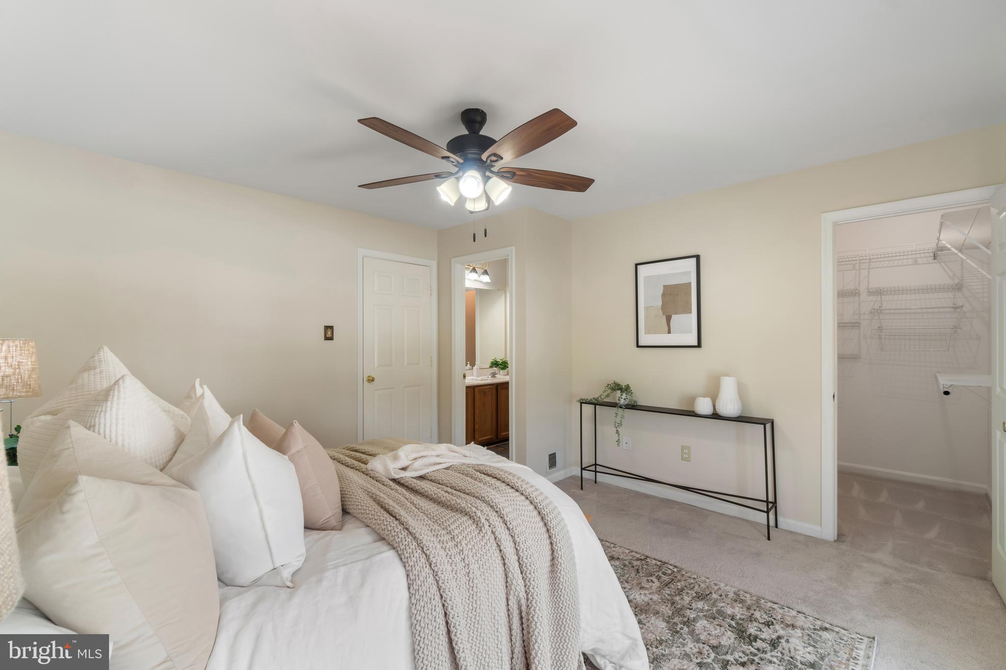 4402 Cole Farm Road Nottingham, MD 21236 - Photo 20 of 42 a bedroom with a bed and a chandelier