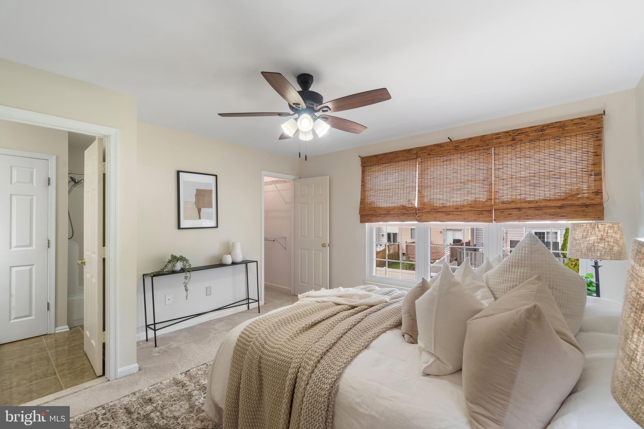 4402 Cole Farm Road Nottingham, MD 21236 - Photo 21 of 42 a bedroom with a large bed and a chandelier