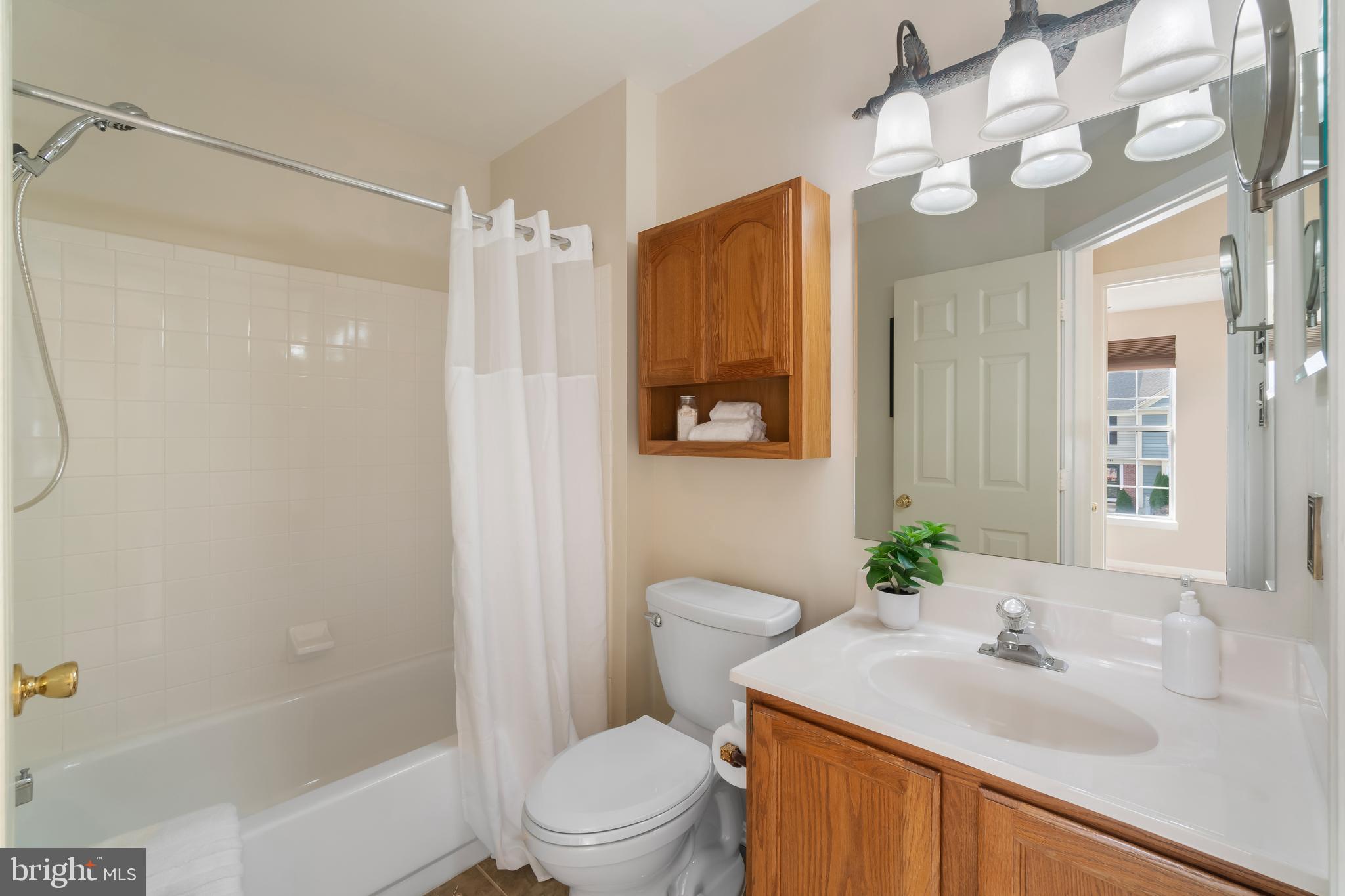 4402 Cole Farm Road Nottingham, MD 21236 - Photo 27 of 42 a bathroom with a sink toilet and shower