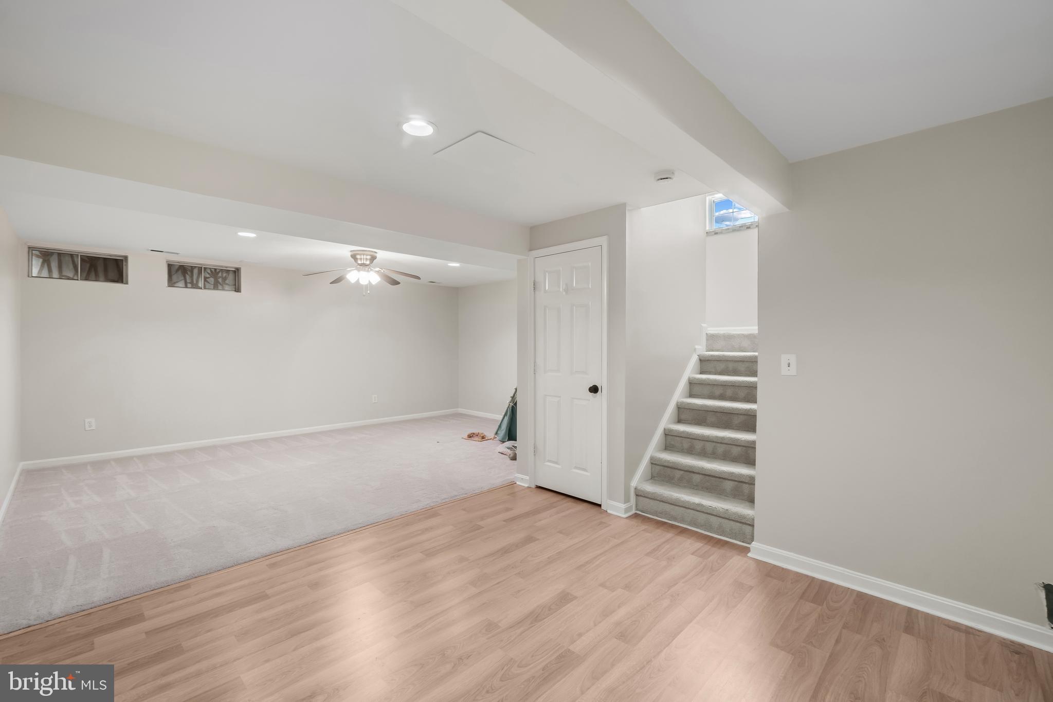 4402 Cole Farm Road Nottingham, MD 21236 - Photo 29 of 42 a view of room with stairs and wooden floor