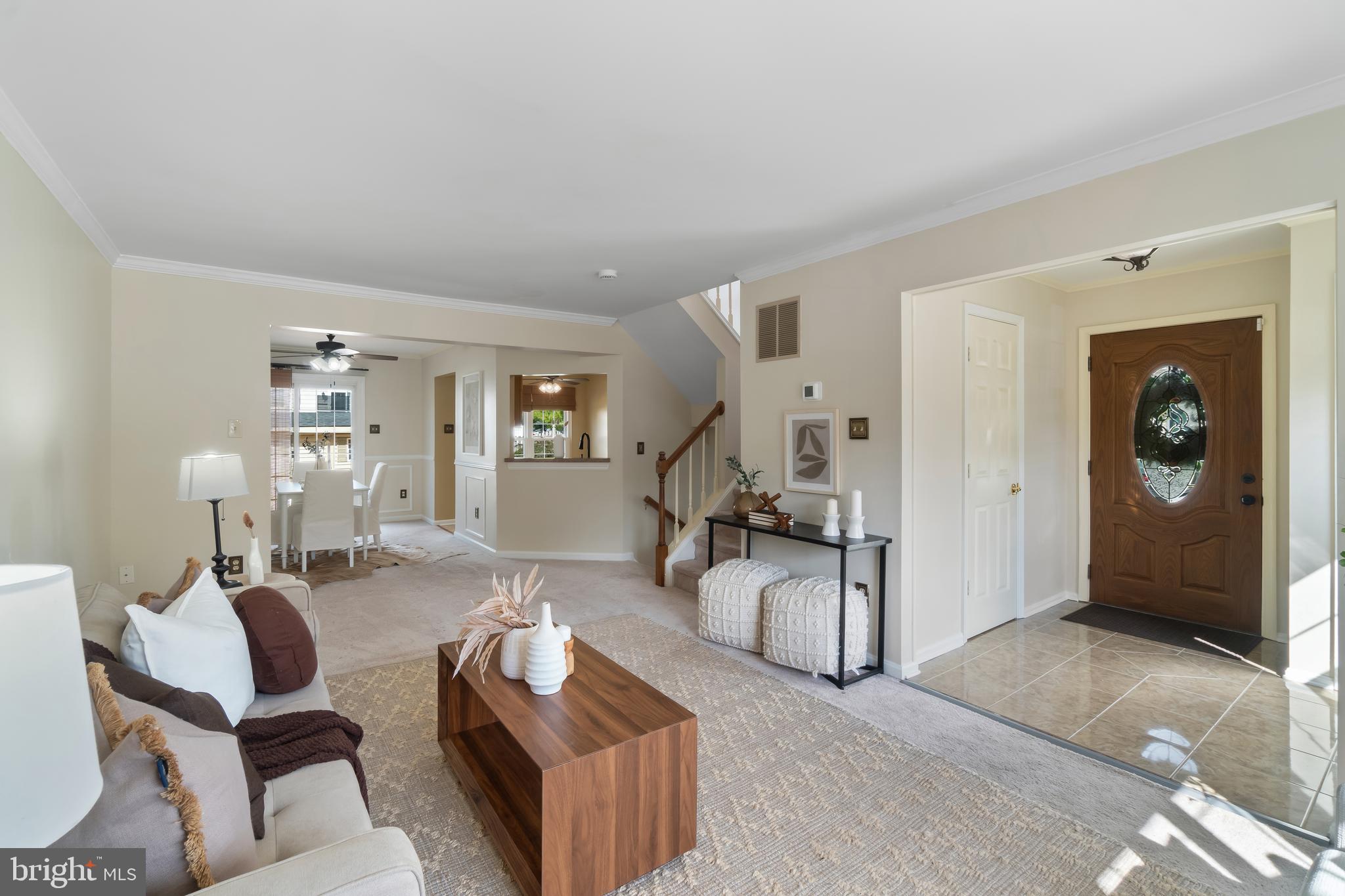 4402 Cole Farm Road Nottingham, MD 21236 - Photo 4 of 42 a living room with furniture a wooden floor and a chandelier
