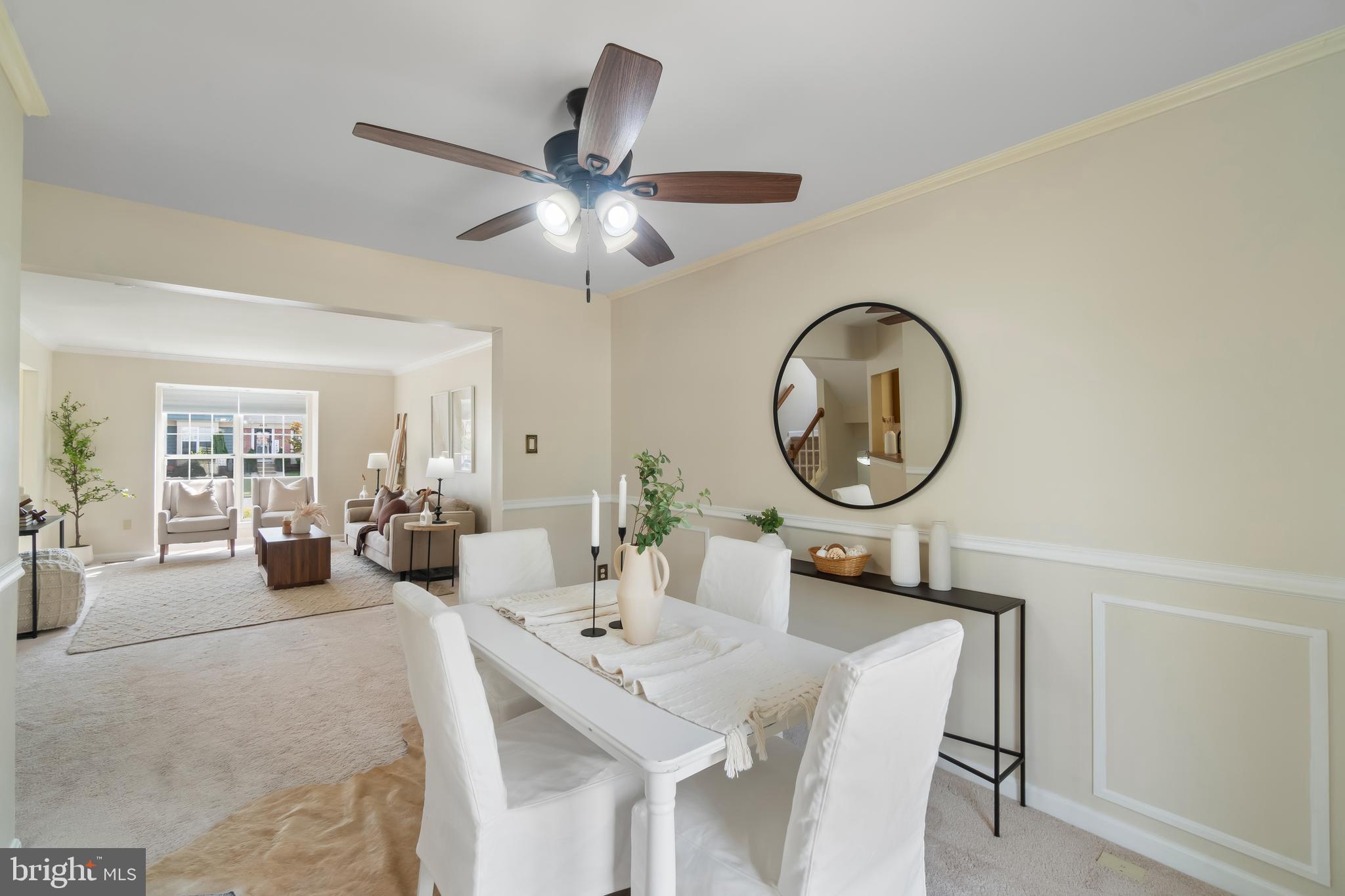 4402 Cole Farm Road Nottingham, MD 21236 - Photo 10 of 42 a living room with furniture a clock potted plant and a large window