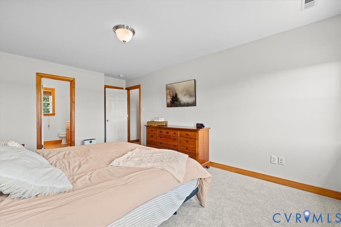 3137 Trenholm Road Powhatan, VA 23139 - Photo 32 of 72 a bedroom with a bed and a night stand