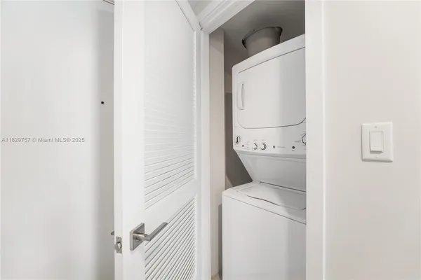 a view of bathroom with washer and dryer