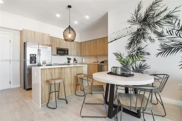 a view of a dining room with furniture wooden floor and chandelier