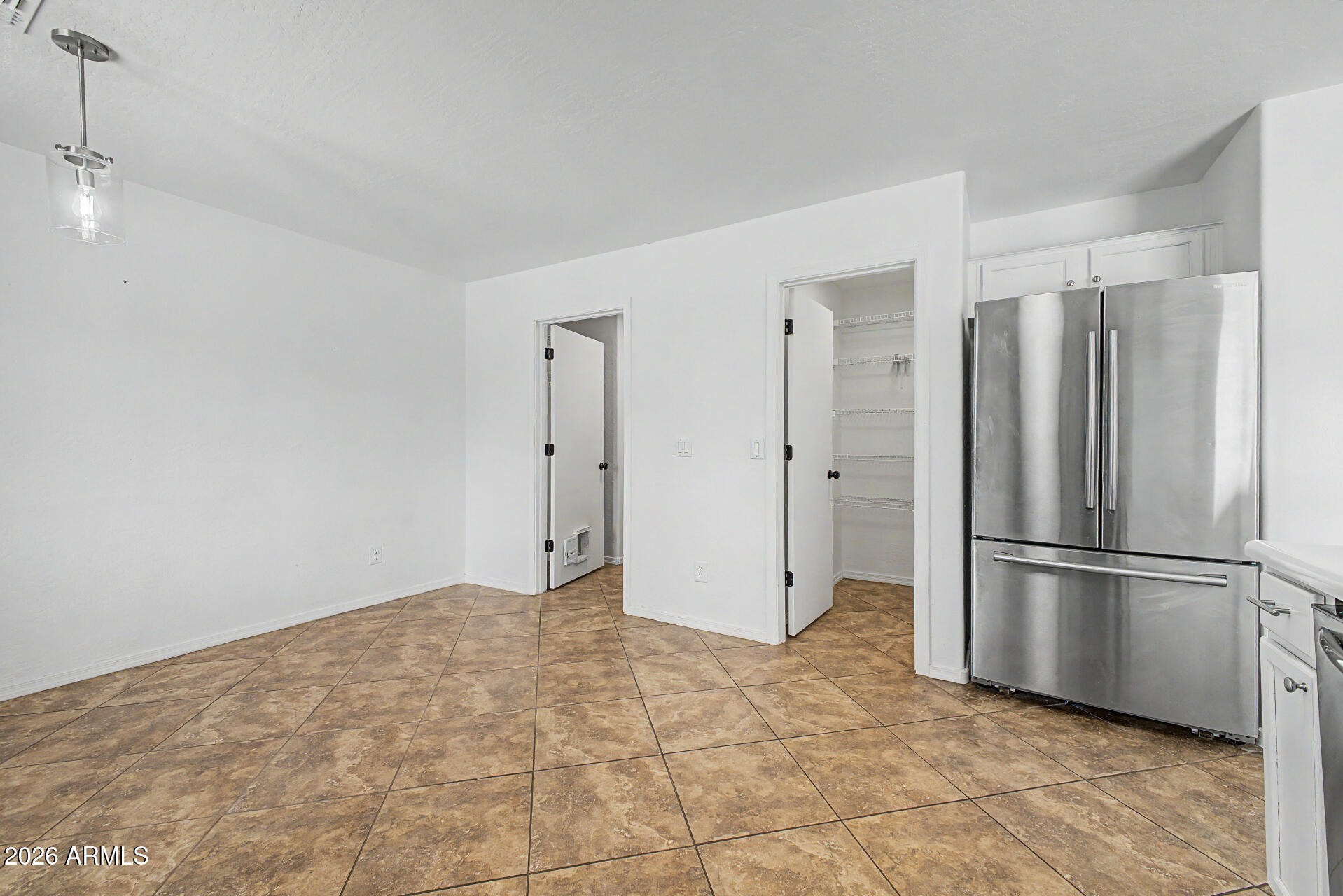 8337 West Payson Road Tolleson, AZ 85353 - Photo 20 of 44 Door to laundryroom/ garage/ Pantry