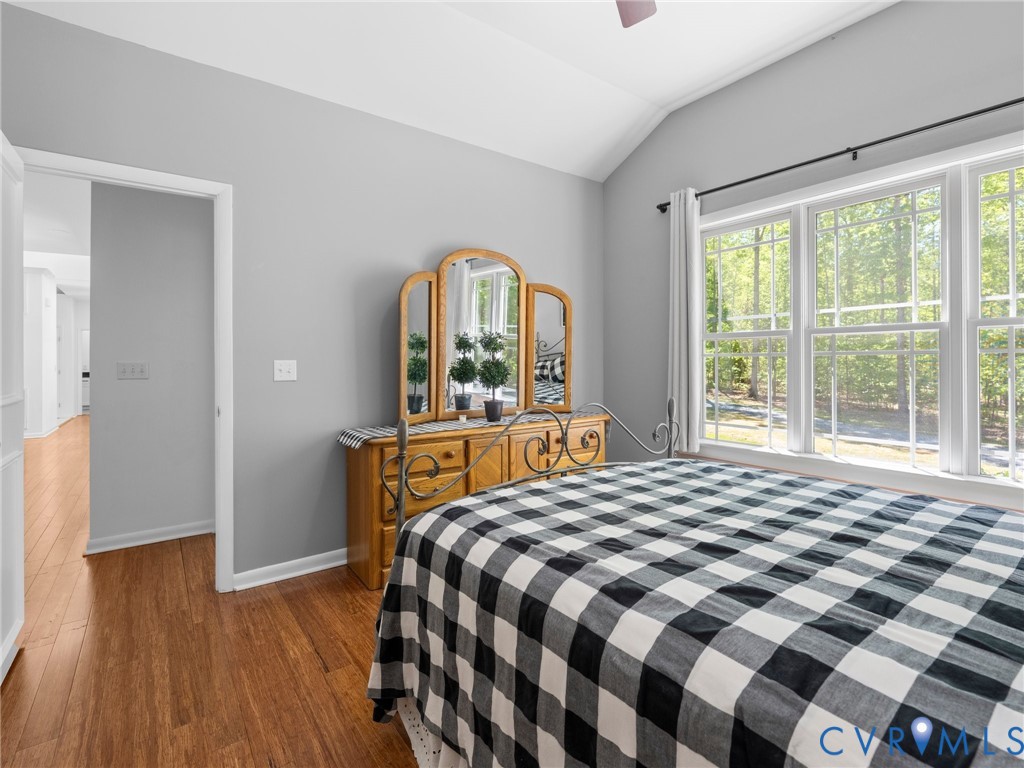 6126 Autumn Bluff Road Powhatan, VA 23139 - Photo 28 of 47 a bedroom with a bed and a large window