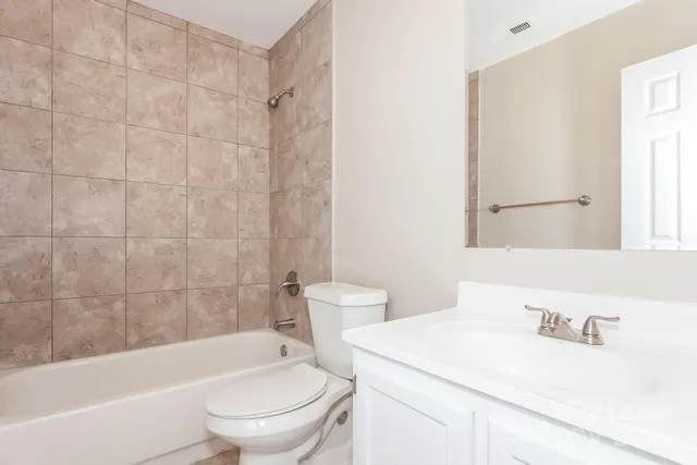 a bathroom with a sink a toilet and a bathtub