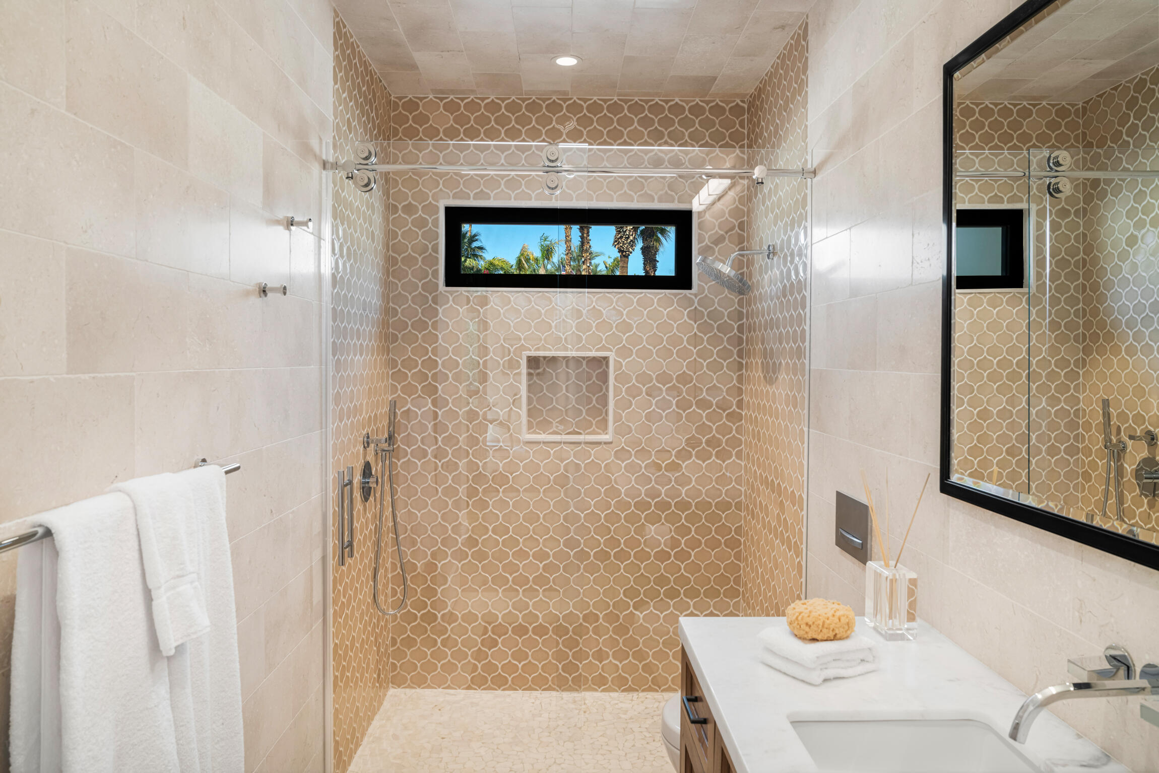 555 West Stevens Road Palm Springs, CA 92262 - Photo 55 of 95 a bathroom with a sink a mirror and a shower
