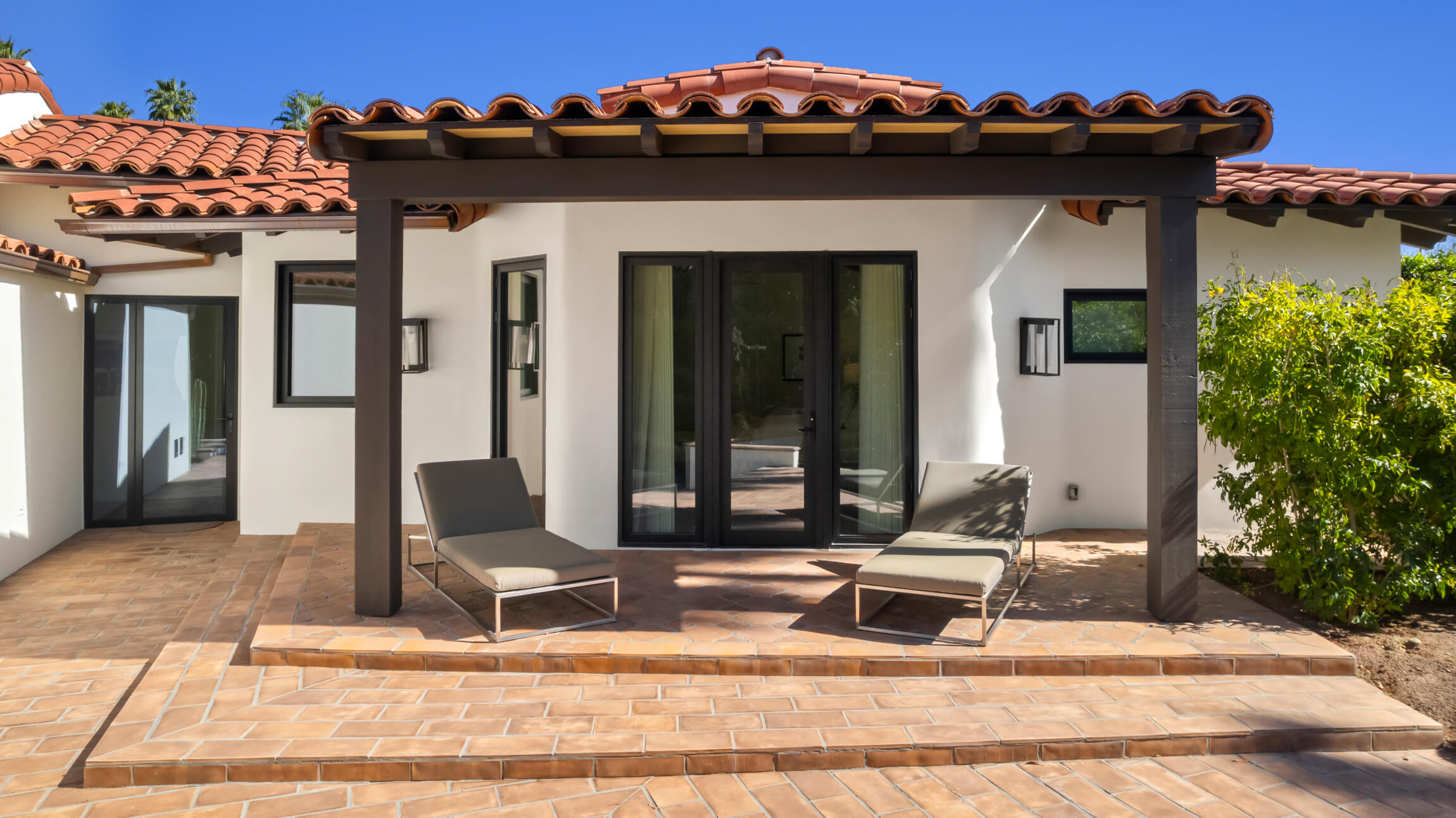 555 West Stevens Road Palm Springs, CA 92262 - Photo 57 of 95 a front view of a house with a garden