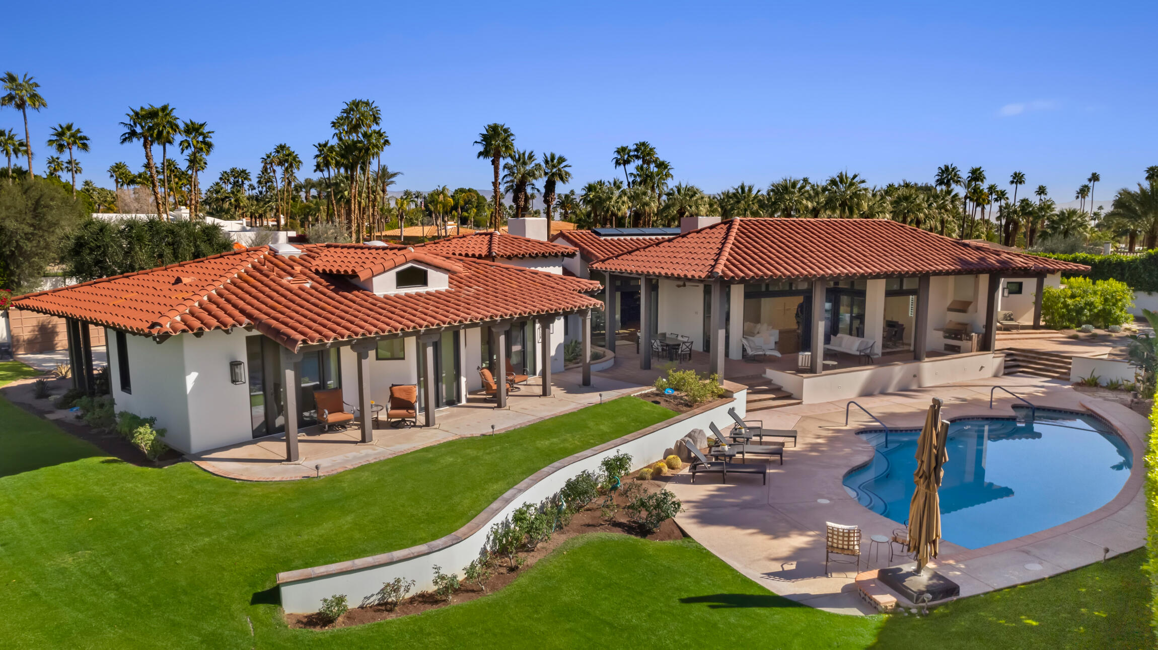555 West Stevens Road Palm Springs, CA 92262 - Photo 69 of 95 a aerial view of a house with swimming pool garden and patio