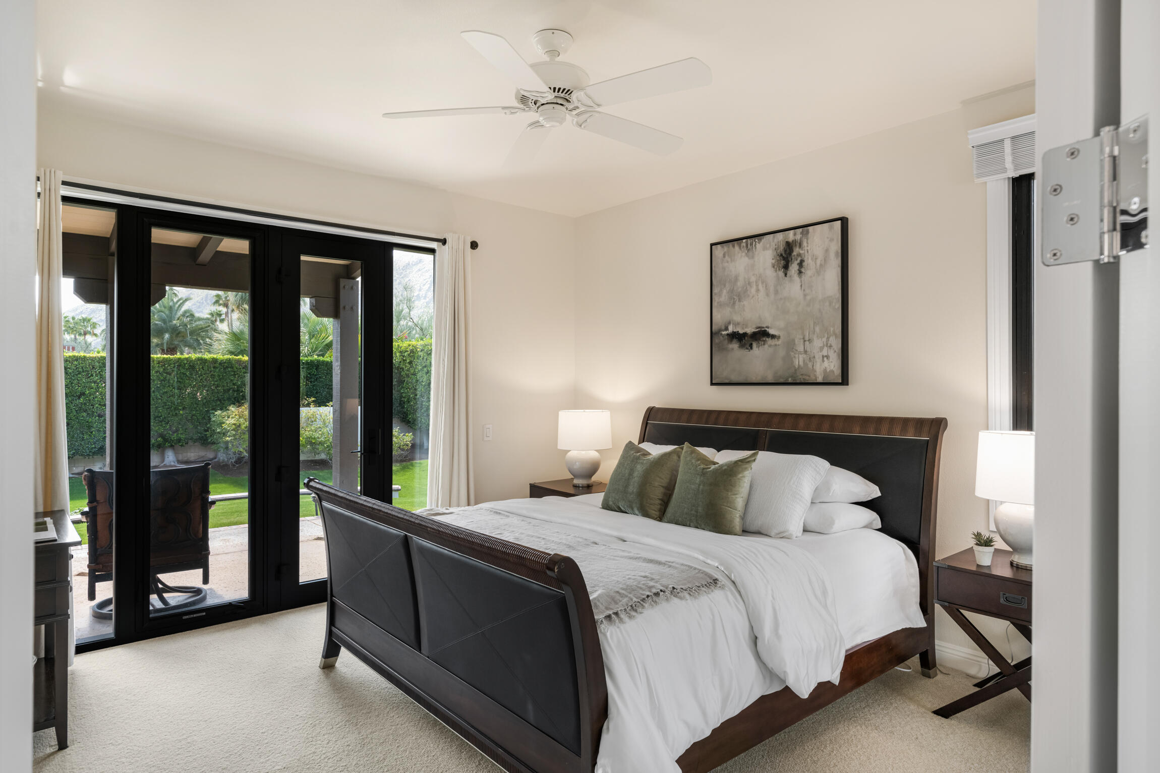 555 West Stevens Road Palm Springs, CA 92262 - Photo 72 of 95 a bedroom with a large bed and a balcony view