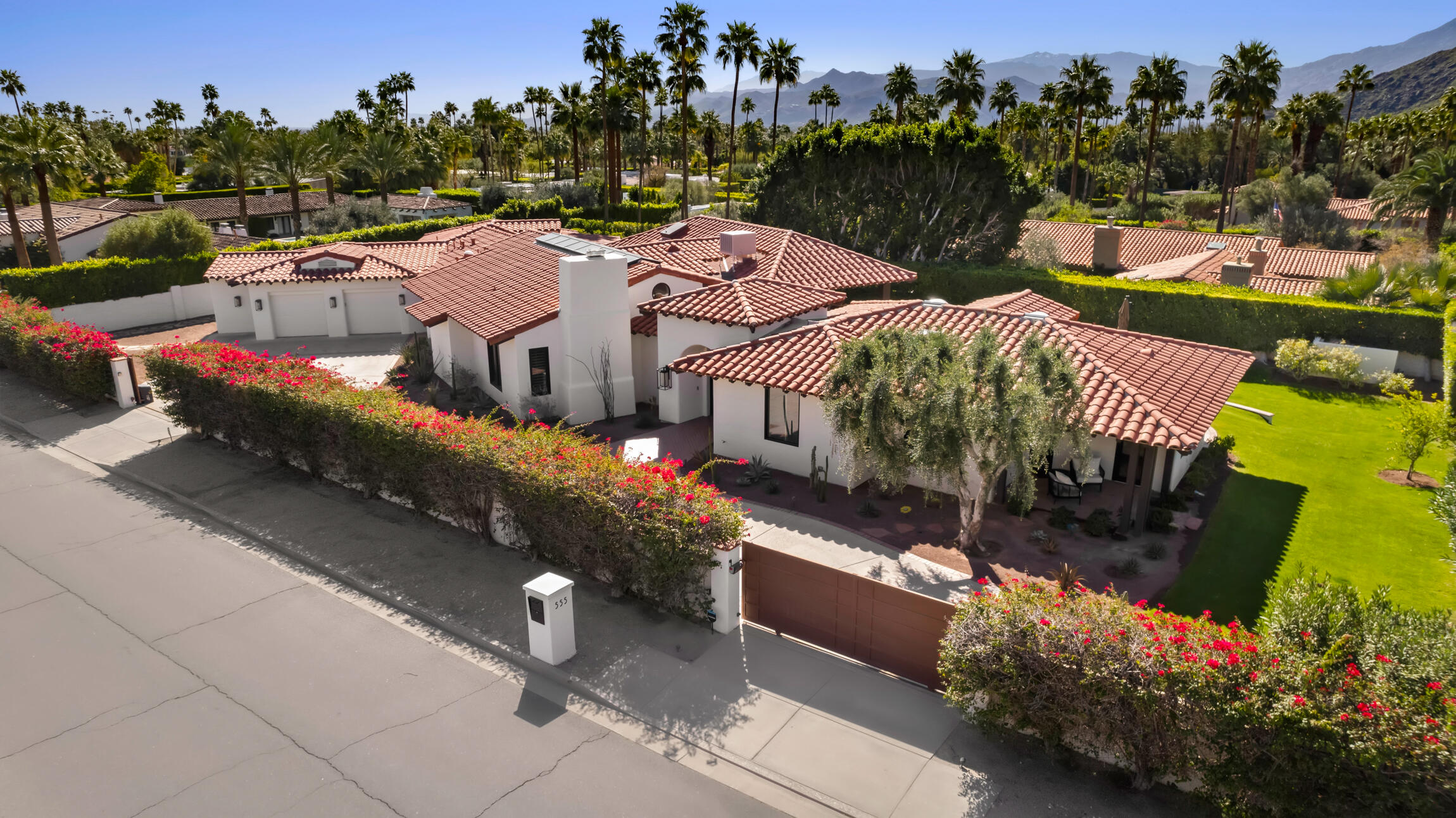 555 West Stevens Road Palm Springs, CA 92262 - Photo 86 of 95 a aerial view of a house with a yard and a fountain