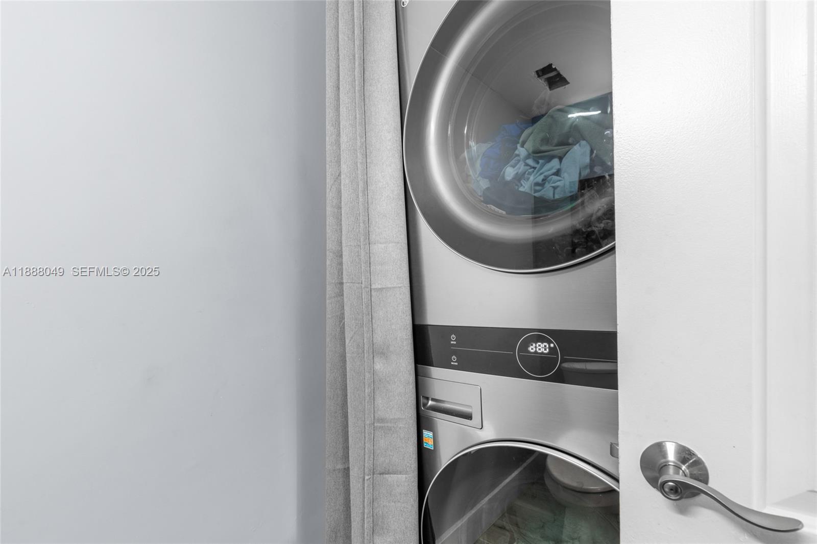 4624 Northwest 97th Place, Unit 252 Doral, FL 33178 - Photo 15 of 28 a utility room with dryer and washer