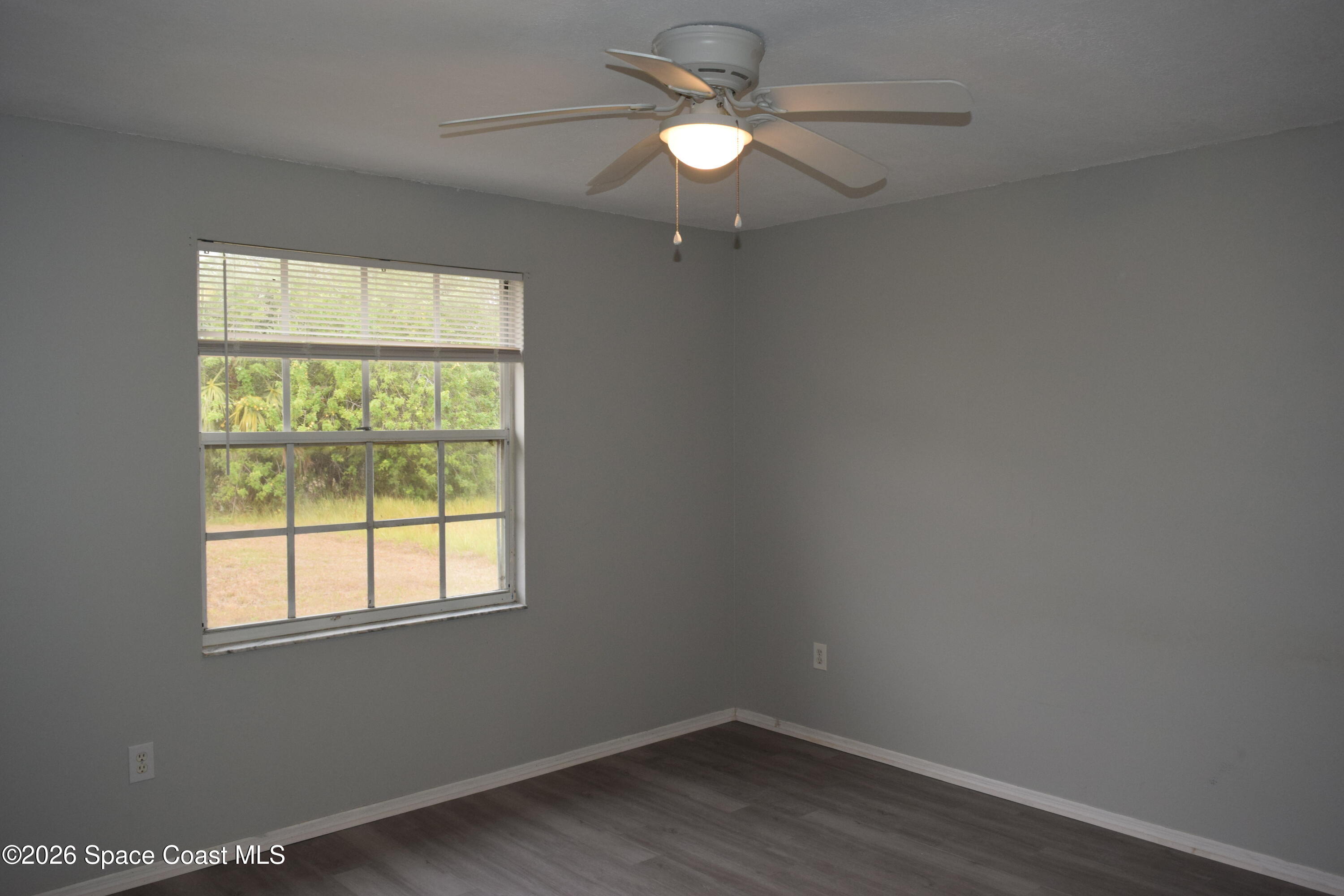 213 Abello Road Southeast Palm Bay, FL 32909 - Photo 12 of 23 an empty room with a window