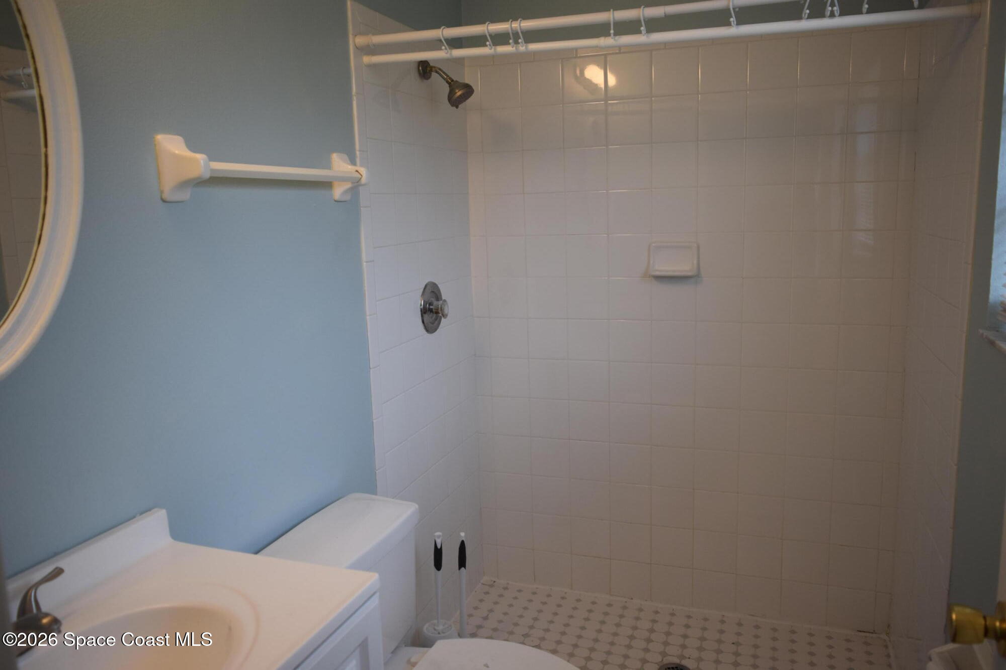 213 Abello Road Southeast Palm Bay, FL 32909 - Photo 15 of 23 a bathroom with a toilet and a shower