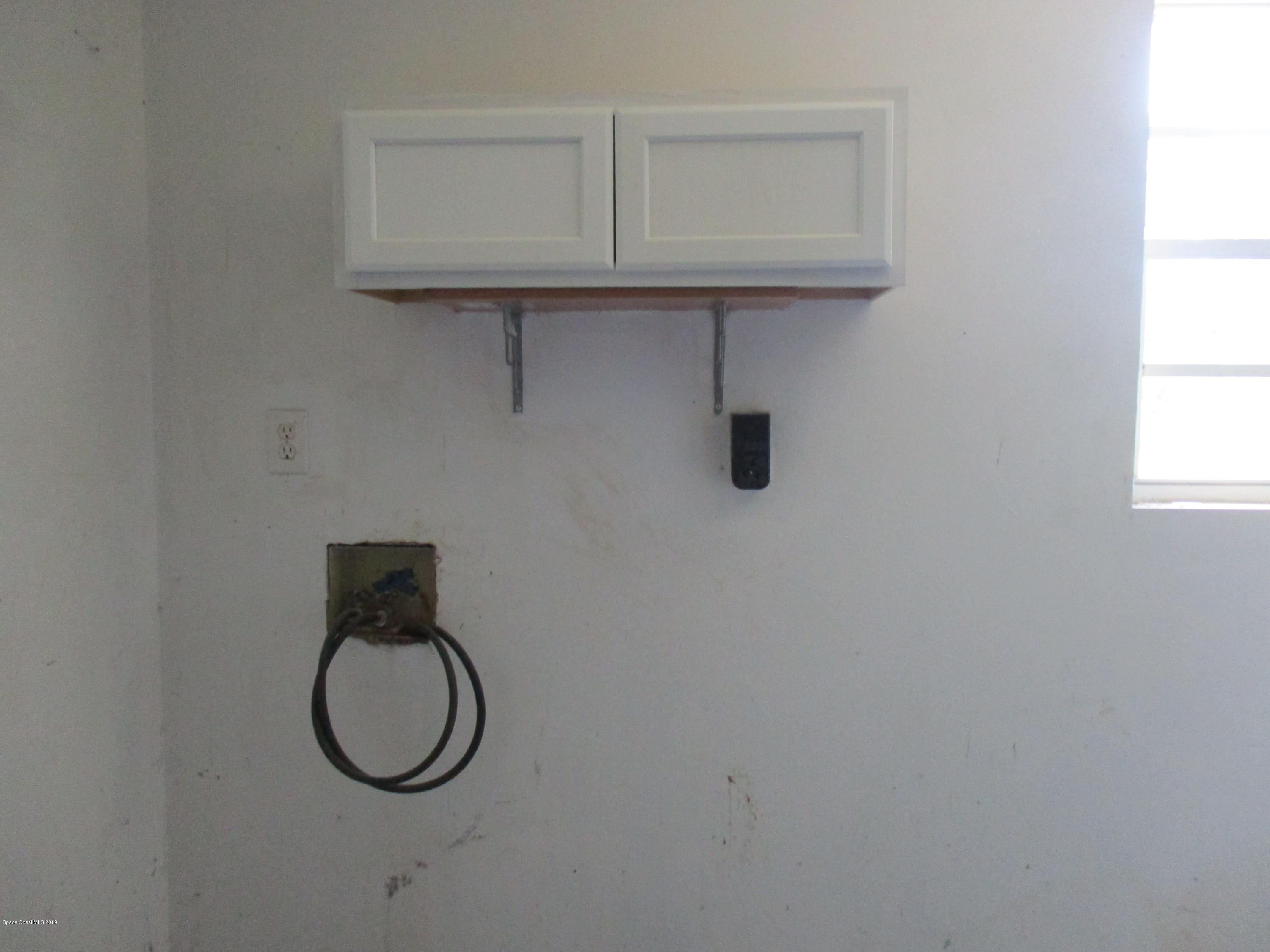 213 Abello Road Southeast Palm Bay, FL 32909 - Photo 21 of 23 a bathroom with a toilet and a sink