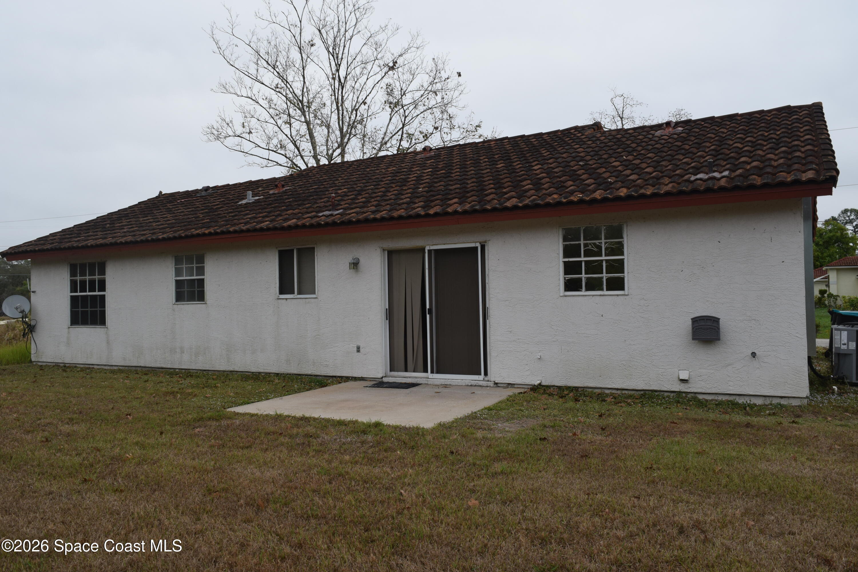 213 Abello Road Southeast Palm Bay, FL 32909 - Photo 23 of 23 a backyard of a house