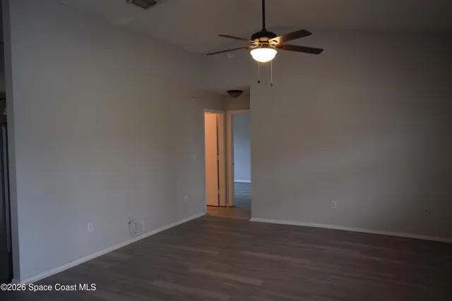 a view of empty room with fan