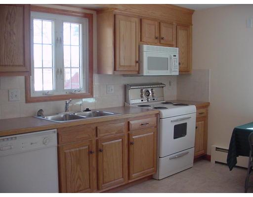 540 Ryan Road Northampton, MA 01062 - Photo 4 of 8 a kitchen with a sink stove and cabinets