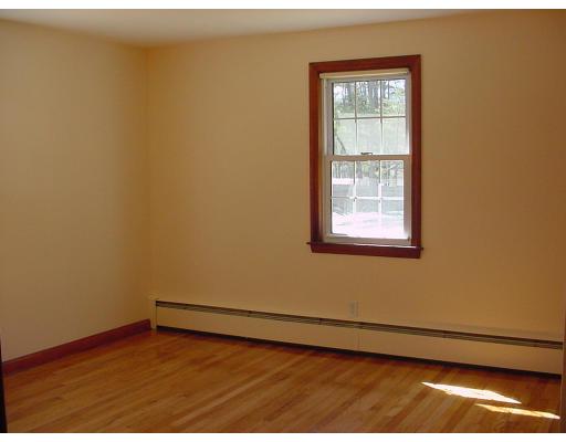 540 Ryan Road Northampton, MA 01062 - Photo 7 of 8 a view of an empty room with wooden floor and a window