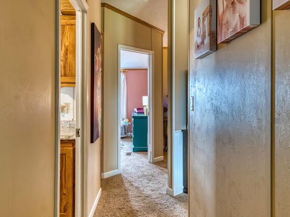 6341 Farm Private Road Levelland, TX 79336 - Photo 30 of 46 a view of a bathroom from a hallway