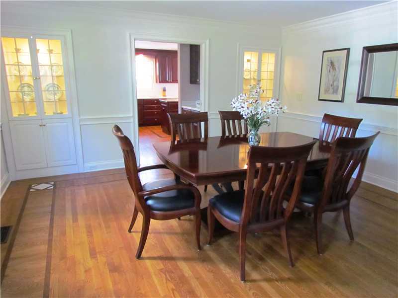 115 Long Neck Point Road Darien, CT 06820 - Photo 11 of 21 a view of a dining room with furniture window and wooden floor