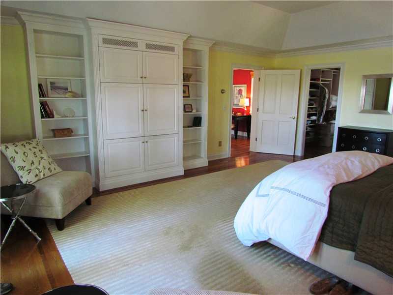 115 Long Neck Point Road Darien, CT 06820 - Photo 15 of 21 a bed room with a bed and a chair