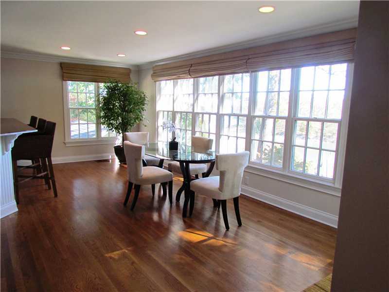 115 Long Neck Point Road Darien, CT 06820 - Photo 9 of 21 a view of a dining room with furniture window and wooden floor