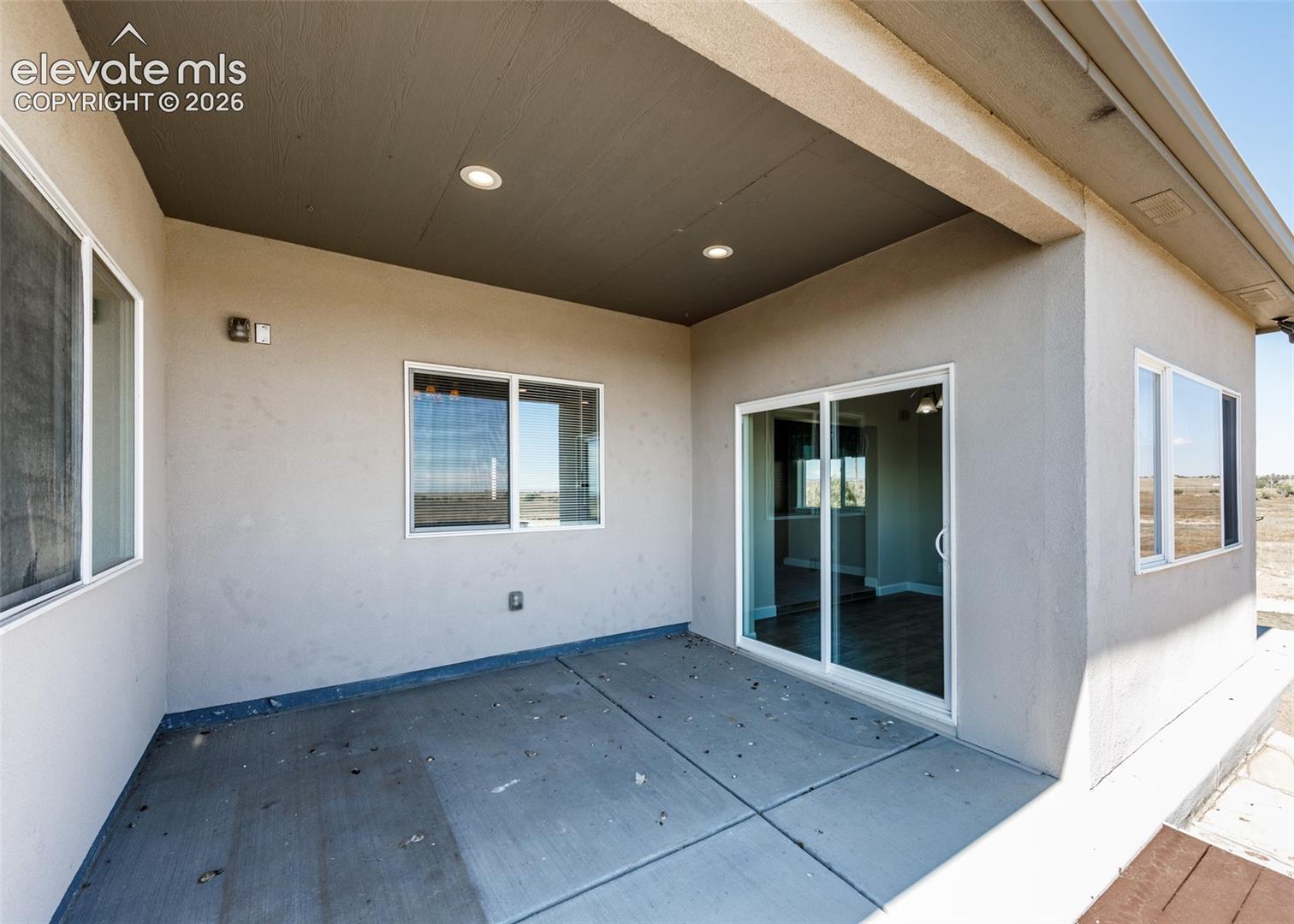 2105 Slocum Road Peyton, CO 80831 - Photo 11 of 26 Covered concrete patio.