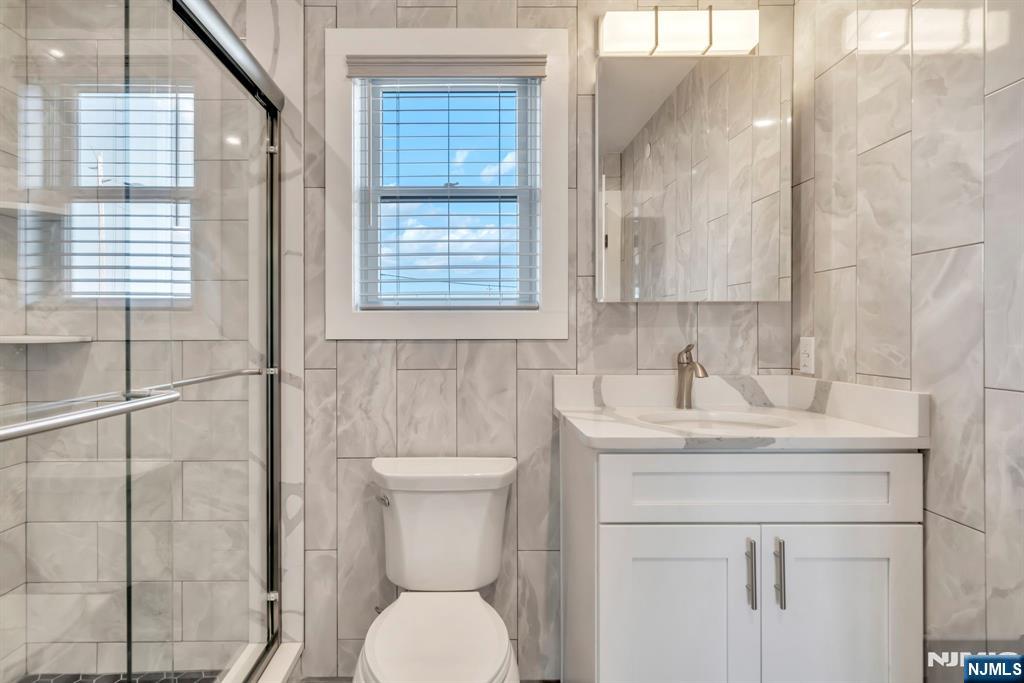 615 Schuyler Avenue, Unit B Lyndhurst, NJ 07071 - Photo 6 of 9 a bathroom with a toilet sink and a shower