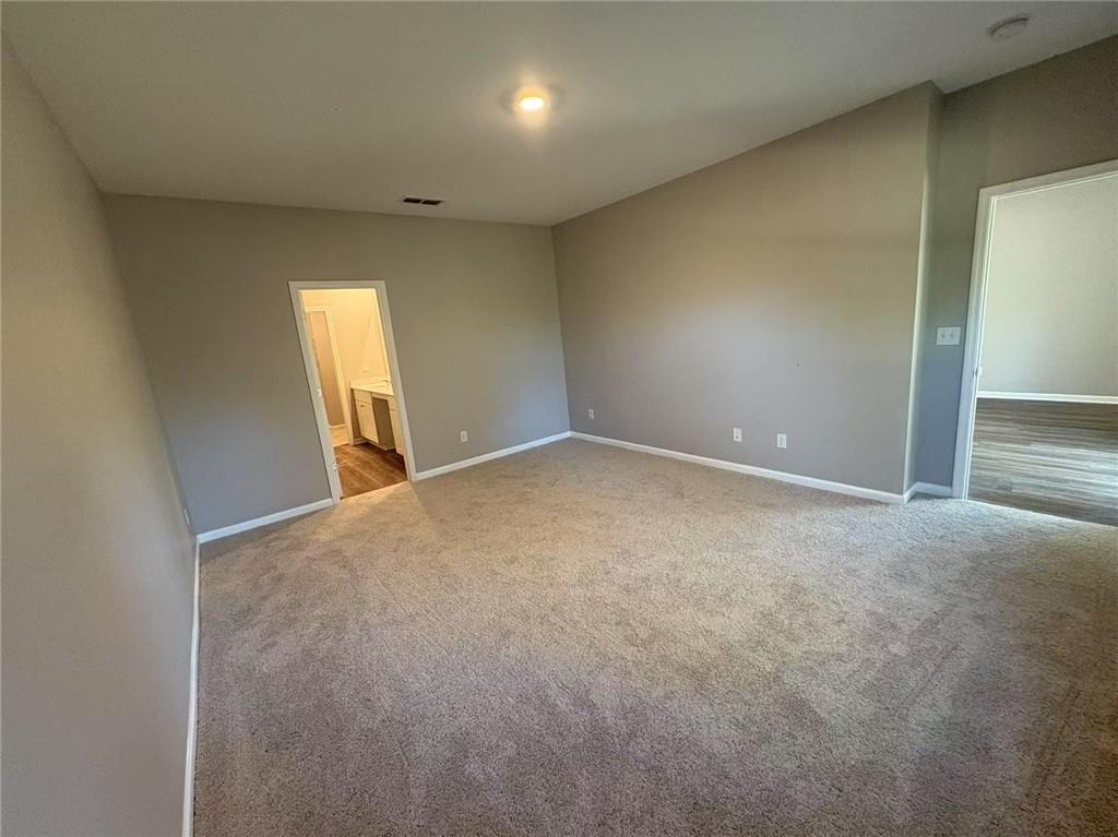 169 Wynn Way Pendergrass, GA 30567 - Photo 11 of 25 an empty room with windows