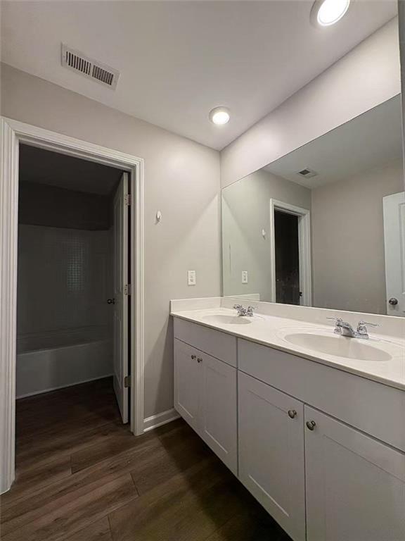 169 Wynn Way Pendergrass, GA 30567 - Photo 17 of 25 a spacious bathroom with a double vanity sink and mirror