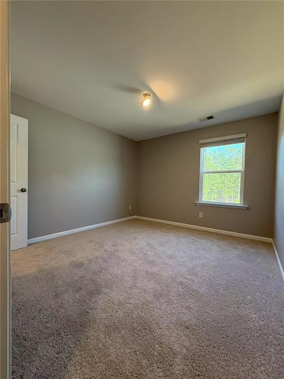 169 Wynn Way Pendergrass, GA 30567 - Photo 21 of 25 an empty room with windows
