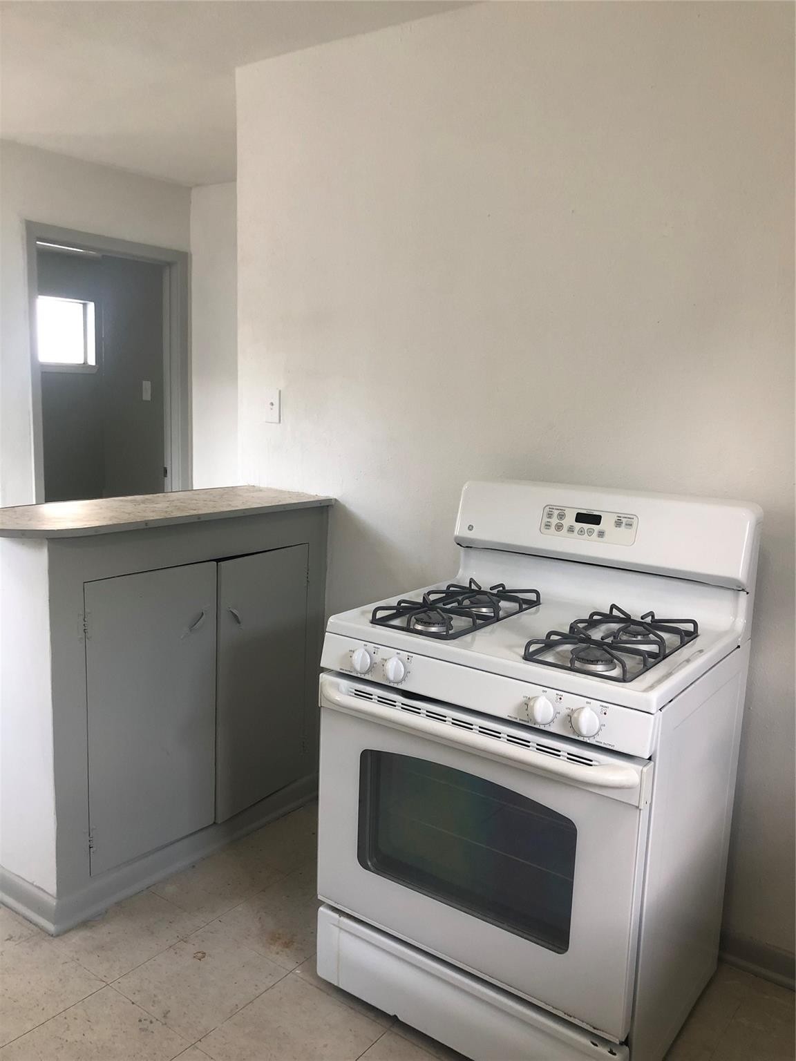 404 James Houston, TX 77009 - Photo 6 of 11 a stove top oven sitting inside of a kitchen