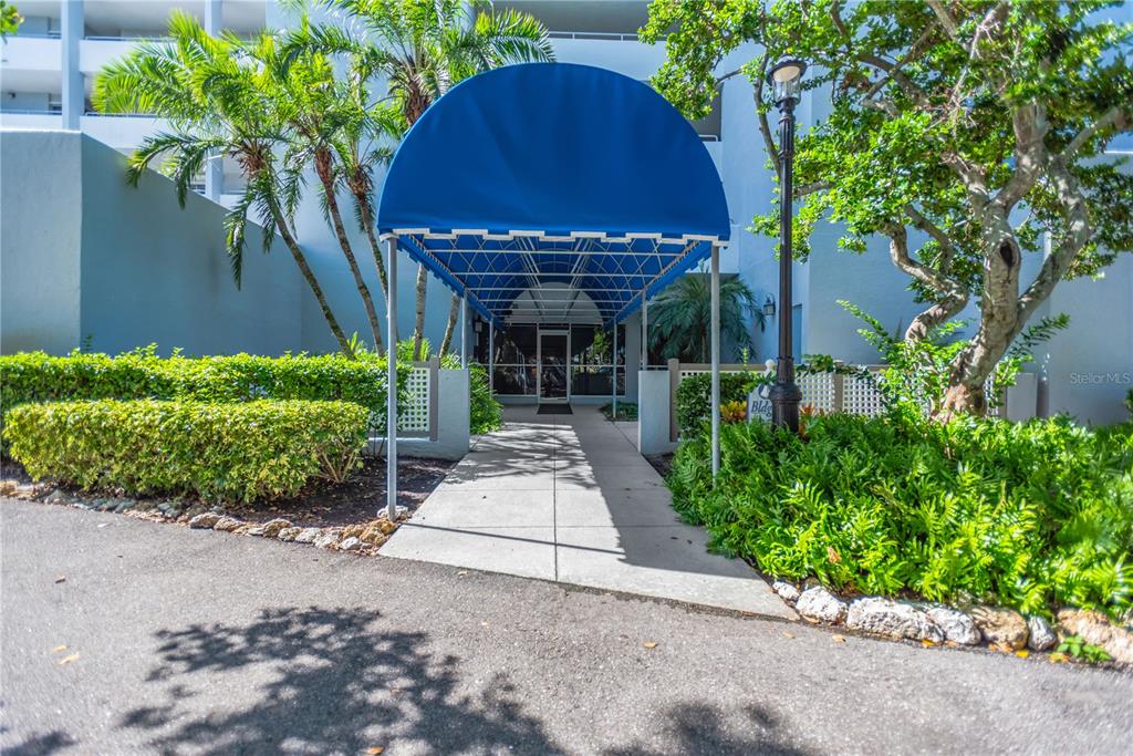 1000 Riverside Drive, Unit B504 Palmetto, FL 34221 - Photo 20 of 48 a front view of a house with a yard