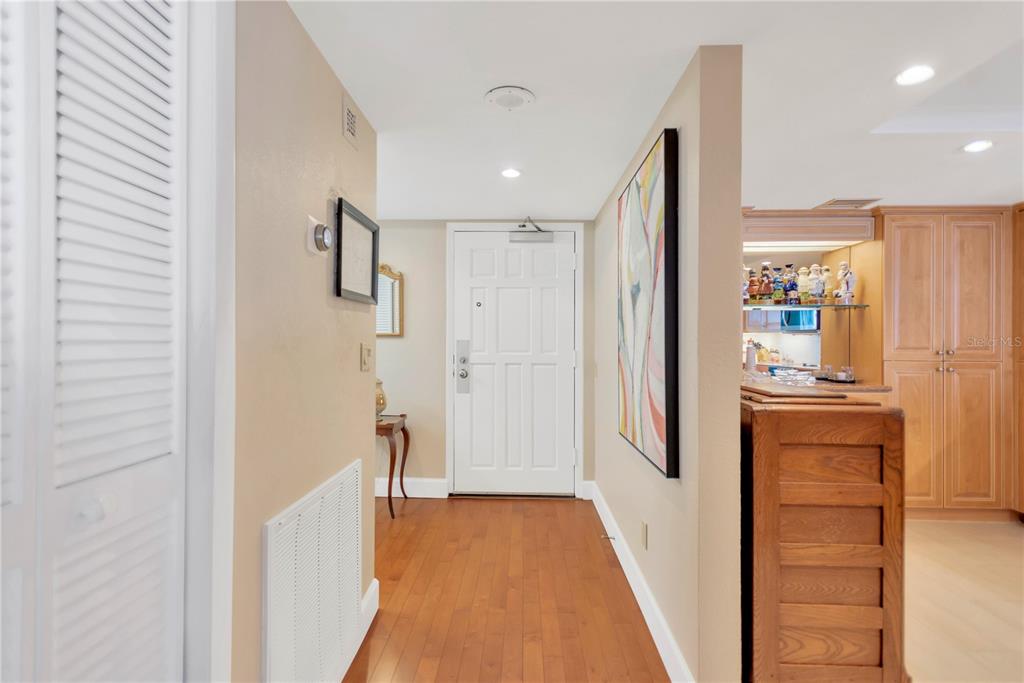 1000 Riverside Drive, Unit B504 Palmetto, FL 34221 - Photo 23 of 48 a view of a hallway with wooden floor and cabinets