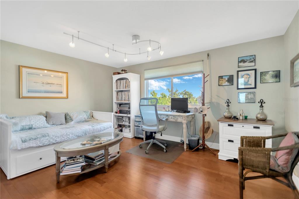 1000 Riverside Drive, Unit B504 Palmetto, FL 34221 - Photo 25 of 48 a living room with furniture and a table