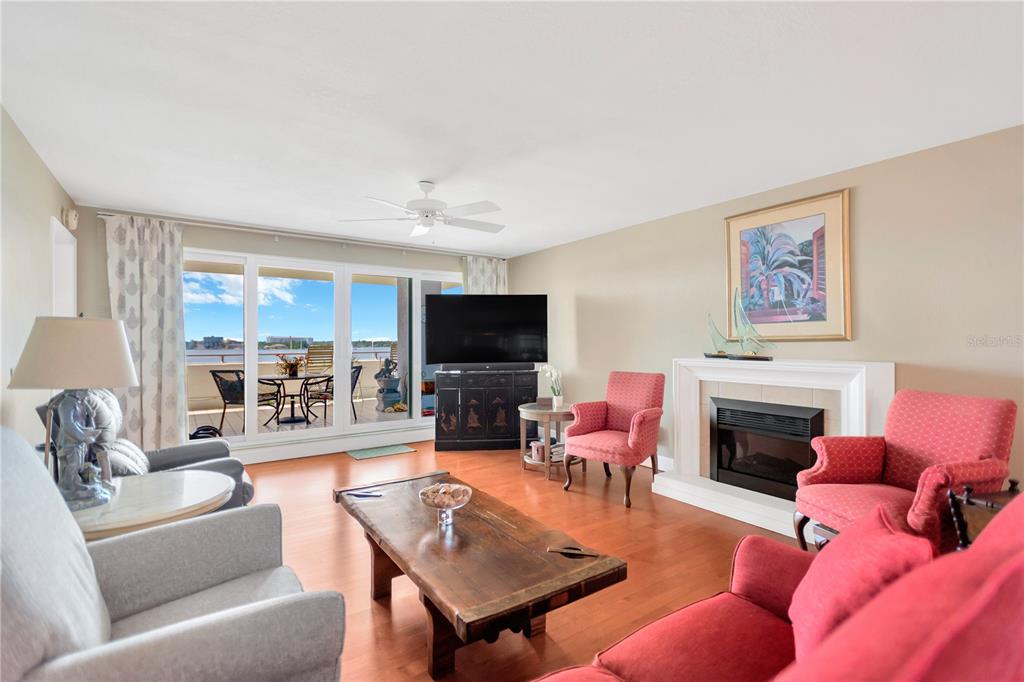 1000 Riverside Drive, Unit B504 Palmetto, FL 34221 - Photo 28 of 48 a living room with furniture a flat screen tv and a fireplace