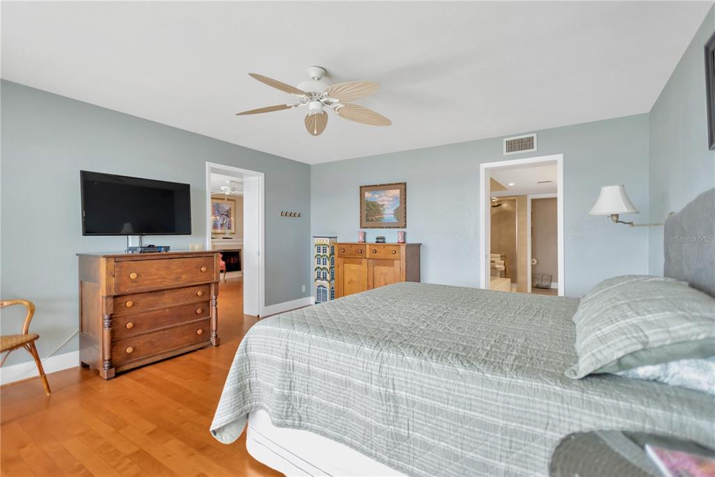 1000 Riverside Drive, Unit B504 Palmetto, FL 34221 - Photo 32 of 48 a bedroom with a bed and wooden floor