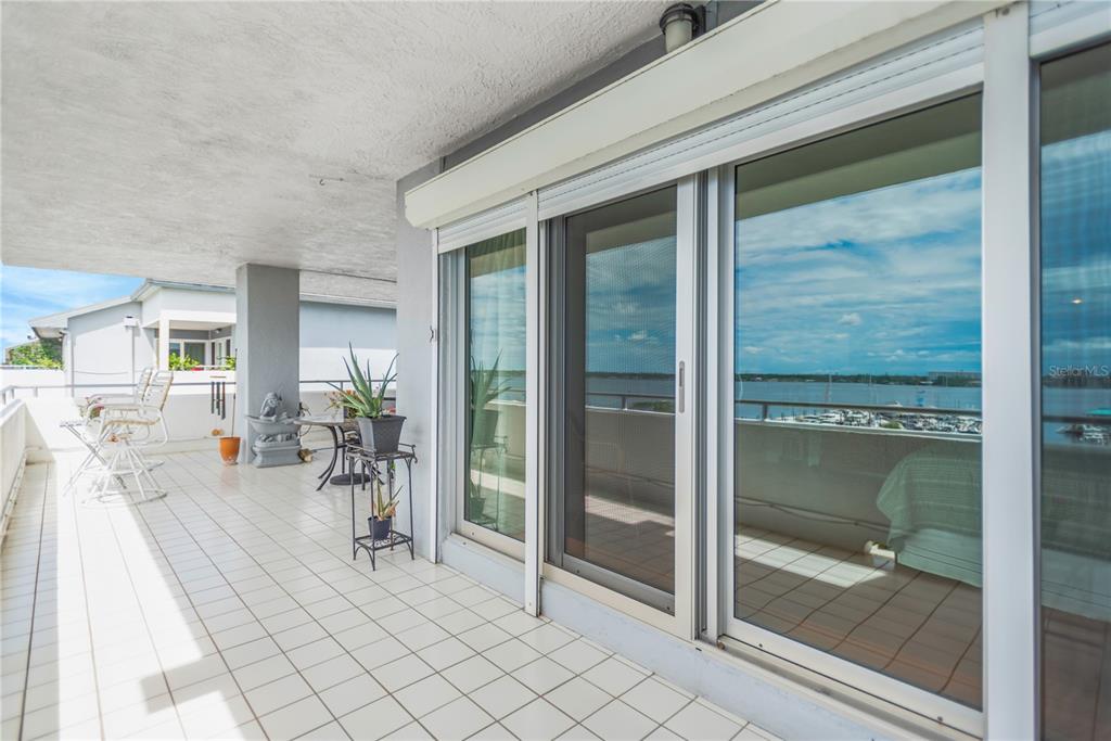 1000 Riverside Drive, Unit B504 Palmetto, FL 34221 - Photo 40 of 48 a view of a livingroom with glass door and porch