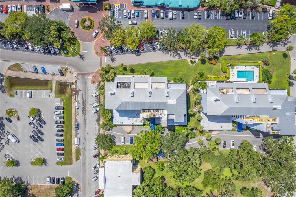 1000 Riverside Drive, Unit B504 Palmetto, FL 34221 - Photo 4 of 48 an aerial view of a city with lots of residential buildings ocean and mountain view in back