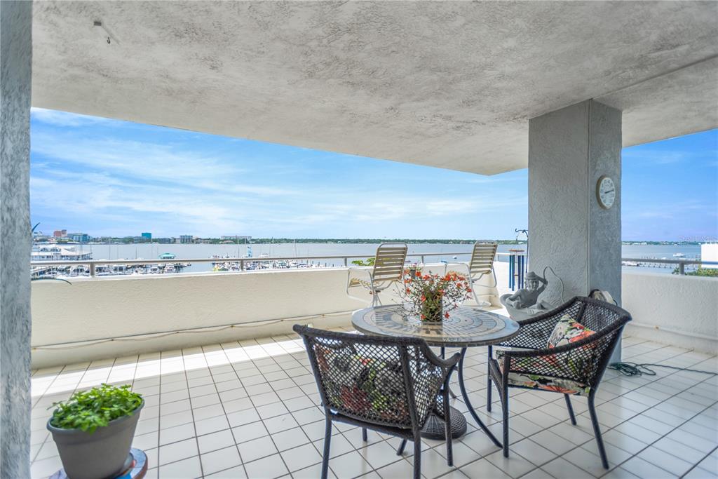 1000 Riverside Drive, Unit B504 Palmetto, FL 34221 - Photo 42 of 48 a view of a terrace with furniture and breakfast area