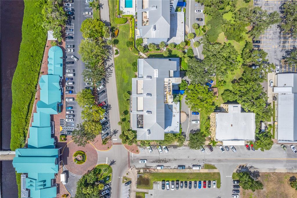 1000 Riverside Drive, Unit B504 Palmetto, FL 34221 - Photo 5 of 48 an aerial view of multi story residential apartment building with yard and parking space