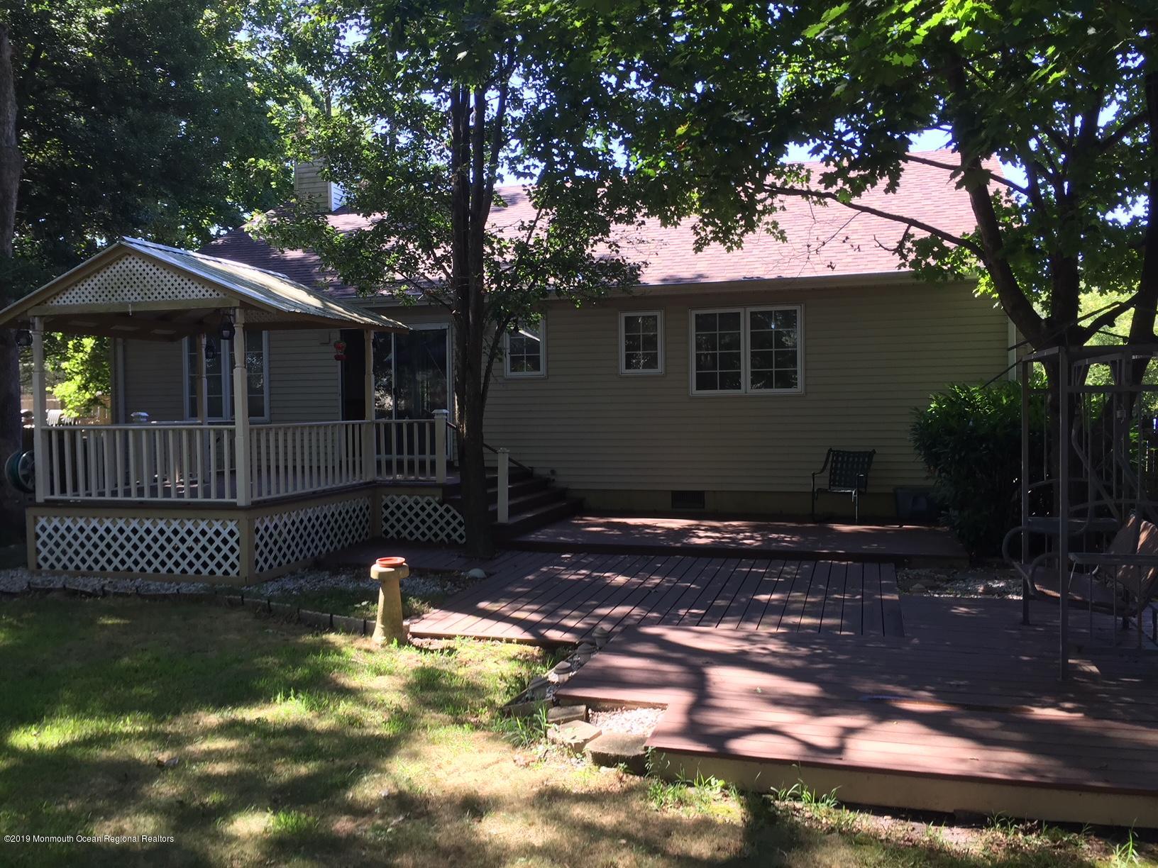 424 Drum Point Road Brick, NJ 08723 - Photo 13 of 15 a view of a house with backyard and sitting area