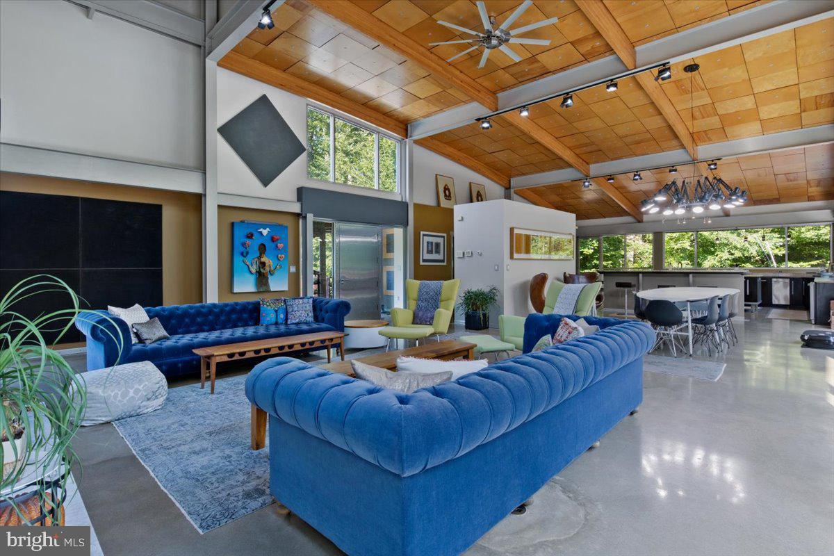 5553 Beverleys Mill Road Broad Run, VA 20137 - Photo 27 of 80 a living room with furniture and a flat screen tv